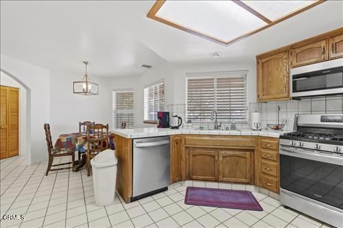 Dining room, Interior, Kitchen, Pendant Lights, Stainless Steel Appliances, Tile Countertops