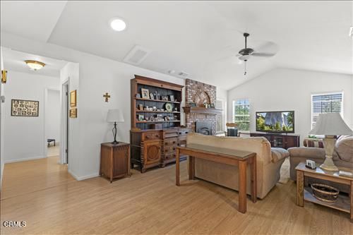 Fireplace, Home Office, Interior, Living room, Recessed Lighting, Stone Walls, Wood Texture Flooring