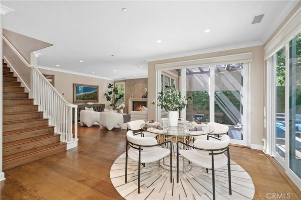 Dining room, Fireplace, Interior, Living room, Recessed Lighting, Wood Texture Flooring