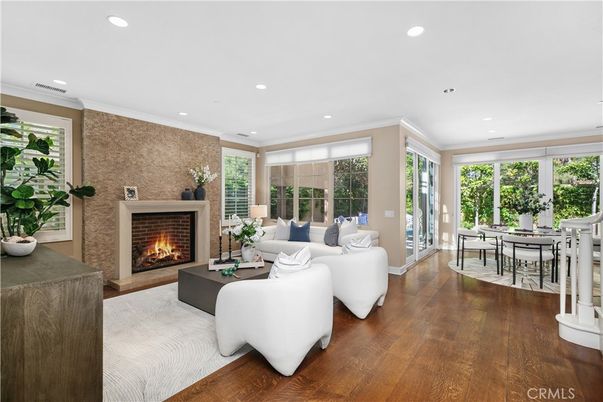 Dining room, Fireplace, Interior, Living room, Recessed Lighting, Stone Walls, Wood Texture Flooring