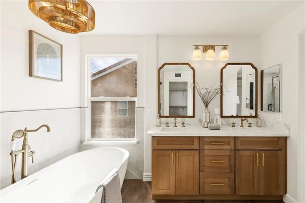 Bathroom, Chandelier, Dual Sink Vanities, Free Standing Baths, Interior, Wood Texture Flooring