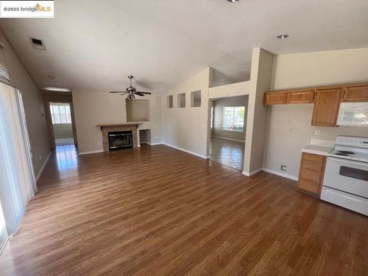 Empty room, Fireplace, Interior, Kitchen, Recessed Lighting, Wood Texture Flooring