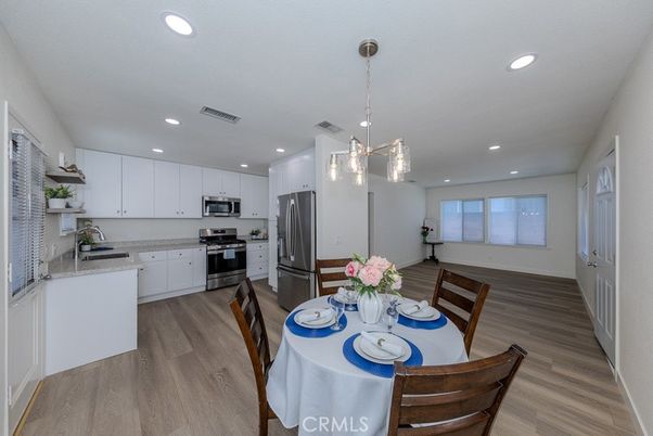 Dining room, Interior, Kitchen, Pendant Lights, Recessed Lighting, Stainless Steel Appliances, Wood Texture Flooring