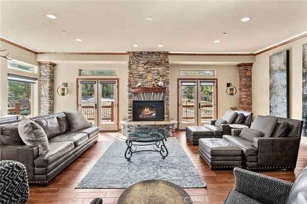 Fireplace, Interior, Living room, Recessed Lighting, Stone Walls, Wood Texture Flooring
