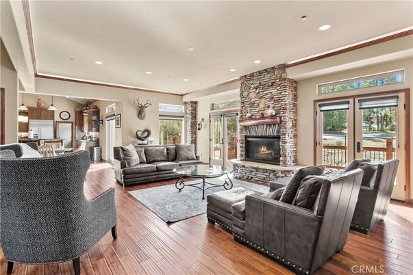 Fireplace, Interior, Living room, Recessed Lighting, Stone Walls, Wood Texture Flooring