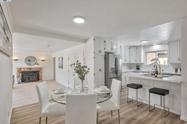 Dining room, Fireplace, Interior, Kitchen, Recessed Lighting, Wood Texture Flooring