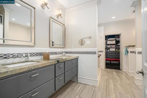 Bathroom, Dual Sink Vanities, Interior, Recessed Lighting, Walk-in Closets, Wood Texture Flooring