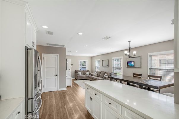 Chandelier, Dining room, Interior, Kitchen, Living room, Recessed Lighting, Wood Texture Flooring