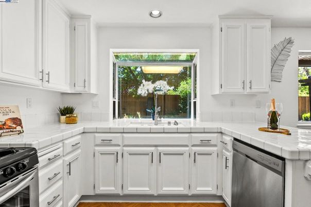 Interior, Kitchen, Recessed Lighting, Stainless Steel Appliances, Tile Countertops, Wood Texture Flooring