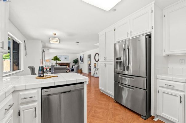 Dining room, Interior, Kitchen, Stainless Steel Appliances, Tile Countertops, Wood Texture Flooring