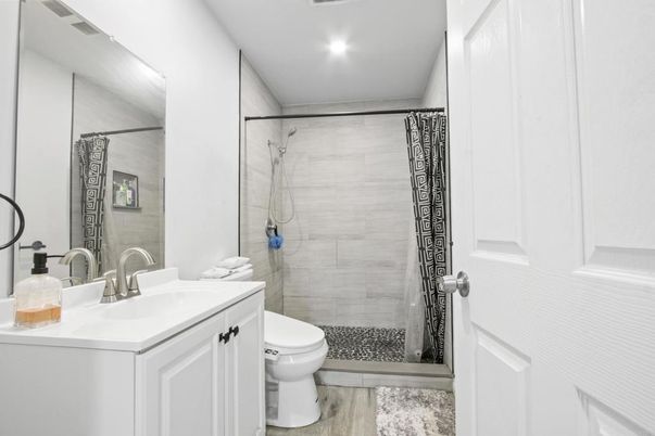 Bathroom, Glass Shower, Interior, Recessed Lighting, Wood Texture Flooring