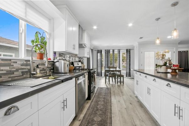 Dining room, Interior, Kitchen, Pendant Lights, Recessed Lighting, Stainless Steel Appliances, Wood Texture Flooring