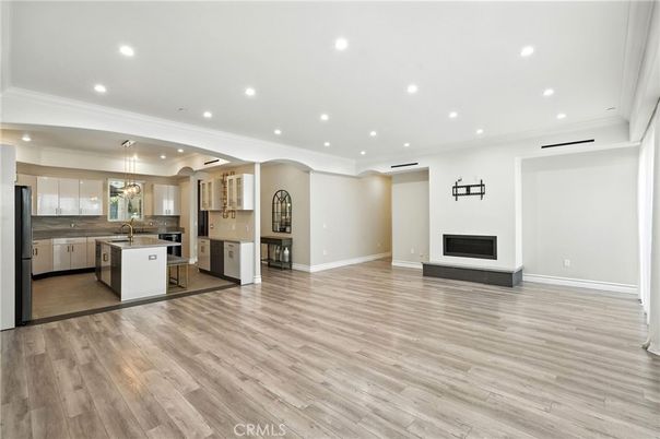 Empty room, Fireplace, Interior, Kitchen, Pendant Lights, Recessed Lighting, Wood Texture Flooring