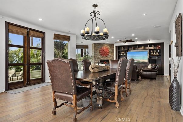Chandelier, Dining room, Fireplace, Interior, Living room, Recessed Lighting, Wood Texture Flooring
