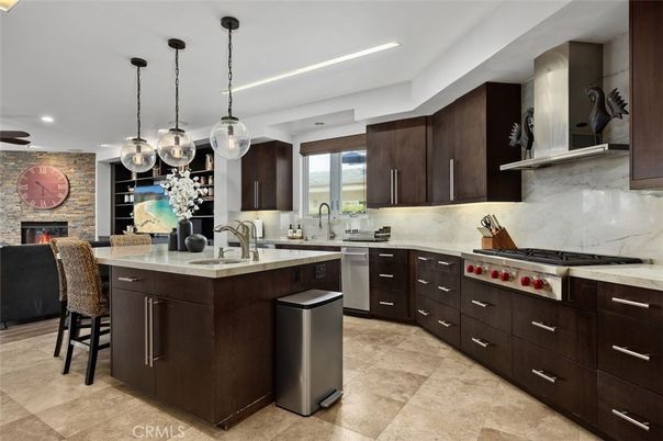 Fireplace, Interior, Kitchen, Pendant Lights, Recessed Lighting, Stainless Steel Appliances, Stone Walls