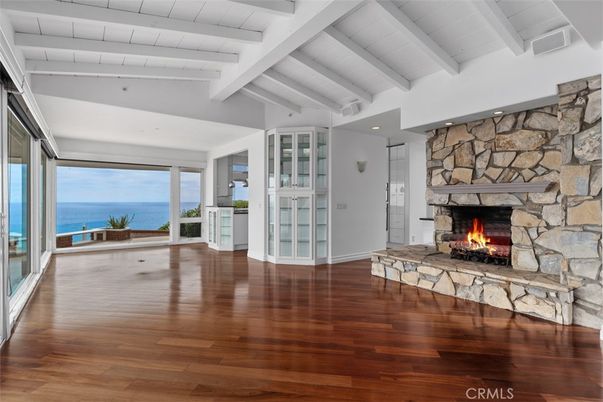 Fireplace, Interior, Recessed Lighting, Stone Walls, Water, Wood Texture Flooring