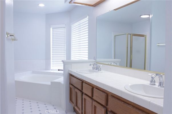 Bathroom, Dual Sink Vanities, Interior, Recessed Lighting, Tile Countertops