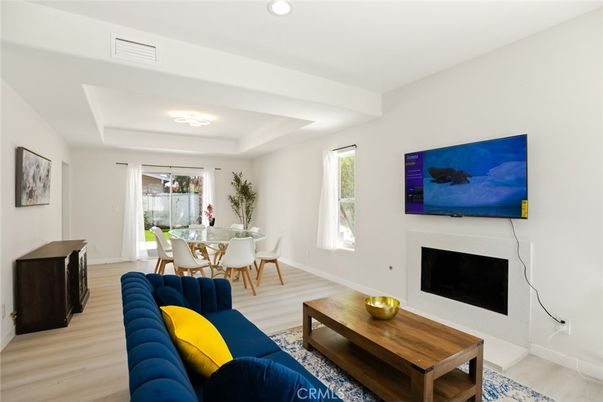 Dining room, Fireplace, Interior, Living room, Recessed Lighting, Wood Texture Flooring