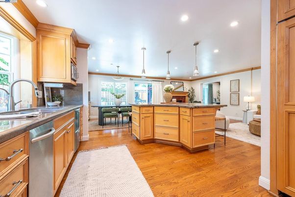 Dining room, Interior, Kitchen, Pendant Lights, Recessed Lighting, Stainless Steel Appliances, Wood Texture Flooring
