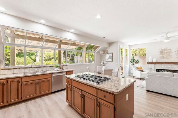 Chandelier, Dining room, Fireplace, Interior, Kitchen, Living room, Pendant Lights, Recessed Lighting, Wood Texture Flooring