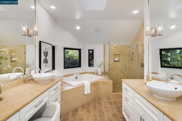 Bathroom, Dual Sink Vanities, Glass Shower, Interior, Recessed Lighting, Wood Texture Flooring