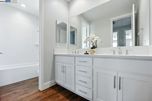 Bathroom, Dual Sink Vanities, Interior, Recessed Lighting, Wood Texture Flooring
