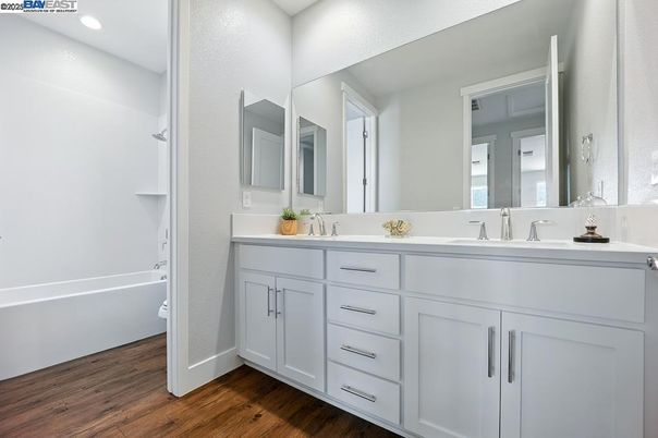 Bathroom, Dual Sink Vanities, Interior, Recessed Lighting, Wood Texture Flooring