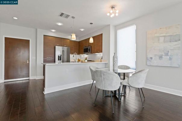 Dining room, Interior, Kitchen, Pendant Lights, Recessed Lighting, Stainless Steel Appliances, Wood Texture Flooring