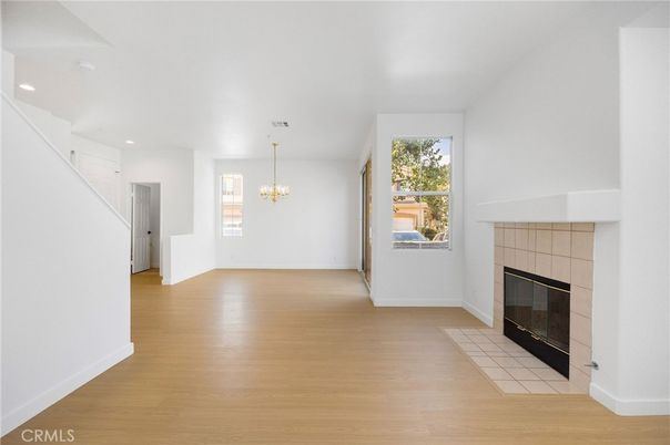 Chandelier, Empty room, Fireplace, Interior, Recessed Lighting, Wood Texture Flooring