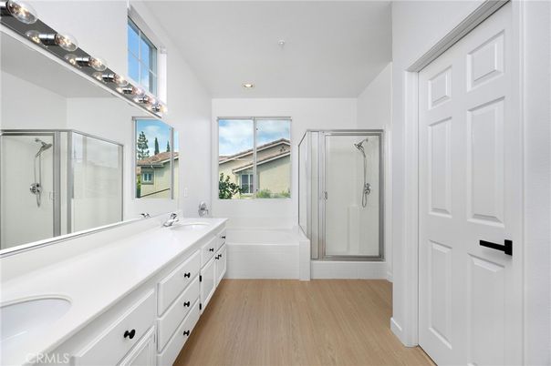 Bathroom, Dual Sink Vanities, Glass Shower, Interior, Recessed Lighting, Wood Texture Flooring