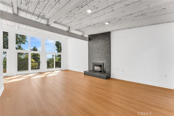 Empty room, Fireplace, Interior, Recessed Lighting, Stone Walls, Wood Texture Flooring