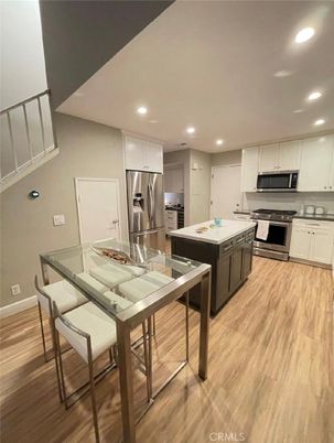 Dining room, Interior, Kitchen, Recessed Lighting, Stainless Steel Appliances, Wood Texture Flooring