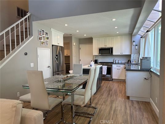 Dining room, Interior, Kitchen, Recessed Lighting, Stainless Steel Appliances, Wood Texture Flooring