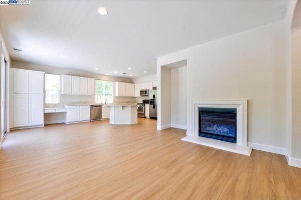 Fireplace, Interior, Kitchen, Recessed Lighting, Stainless Steel Appliances, Wood Texture Flooring