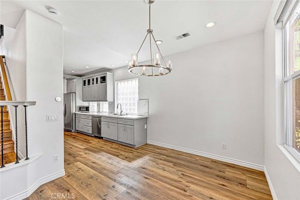 Chandelier, Interior, Kitchen, Pendant Lights, Recessed Lighting, Stainless Steel Appliances, Wood Texture Flooring