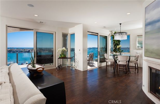 Chandelier, Dining room, Fireplace, Interior, Pendant Lights, Recessed Lighting, Water, Wood Texture Flooring