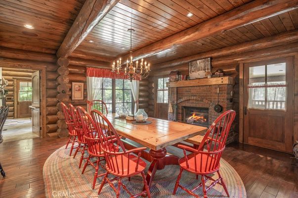 Chandelier, Dining room, Fireplace, Interior, Recessed Lighting, Wooden Beams, Wooden Ceilings, Wood Texture Flooring, Wooden Walls