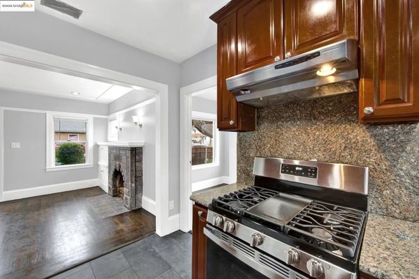 Fireplace, Interior, Kitchen, Recessed Lighting, Stainless Steel Appliances, Wood Texture Flooring