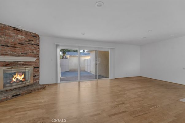 Empty room, Fireplace, Interior, Recessed Lighting, Stone Walls, Wood Texture Flooring