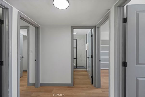 Bathroom, Glass Shower, Interior, Marble Walls, Wood Texture Flooring