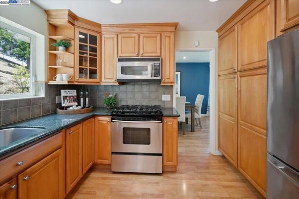 Dining room, Interior, Kitchen, Recessed Lighting, Stainless Steel Appliances, Wood Texture Flooring