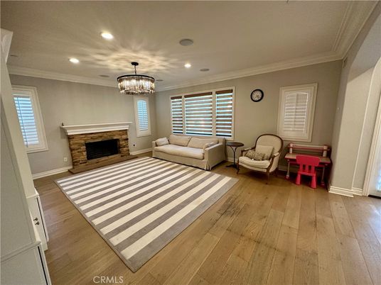 Chandelier, Fireplace, Interior, Living room, Recessed Lighting, Wood Texture Flooring
