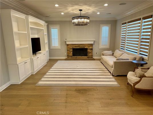 Chandelier, Fireplace, Interior, Living room, Recessed Lighting, Wood Texture Flooring