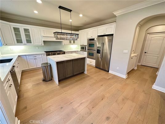 Chandelier, Interior, Kitchen, Pendant Lights, Recessed Lighting, Stainless Steel Appliances, Wood Texture Flooring