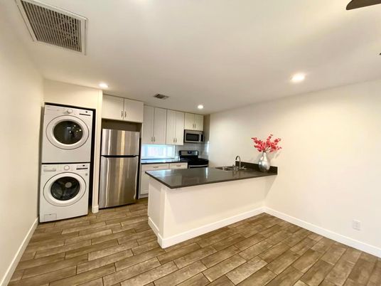 Interior, Kitchen, Recessed Lighting, Washer, Wood Texture Flooring