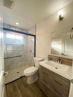 Bathroom, Glass Shower, Interior, Marble Walls, Recessed Lighting, Wood Texture Flooring
