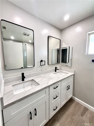 Bathroom, Dual Sink Vanities, Interior, Recessed Lighting, Wood Texture Flooring