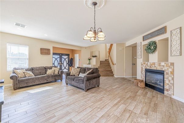 Chandelier, Fireplace, Interior, Living room, Recessed Lighting, Wood Texture Flooring