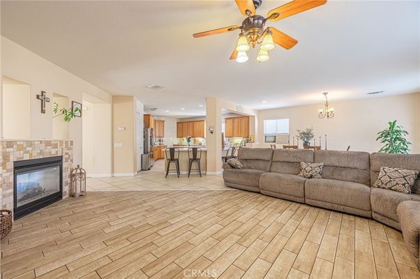 Chandelier, Dining room, Fireplace, Interior, Kitchen, Living room, Recessed Lighting, Wood Texture Flooring