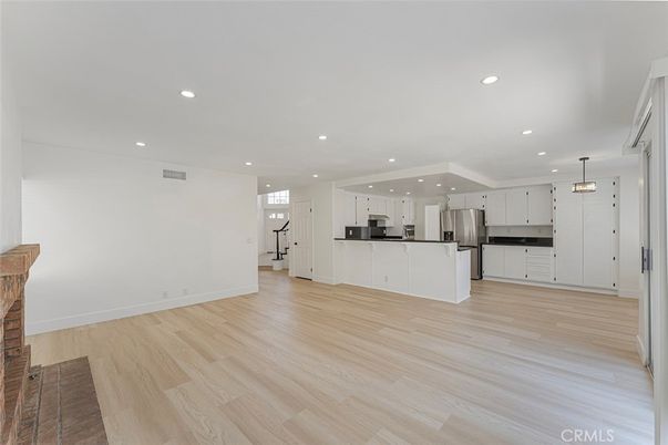 Empty room, Interior, Kitchen, Pendant Lights, Recessed Lighting, Stainless Steel Appliances, Wood Texture Flooring